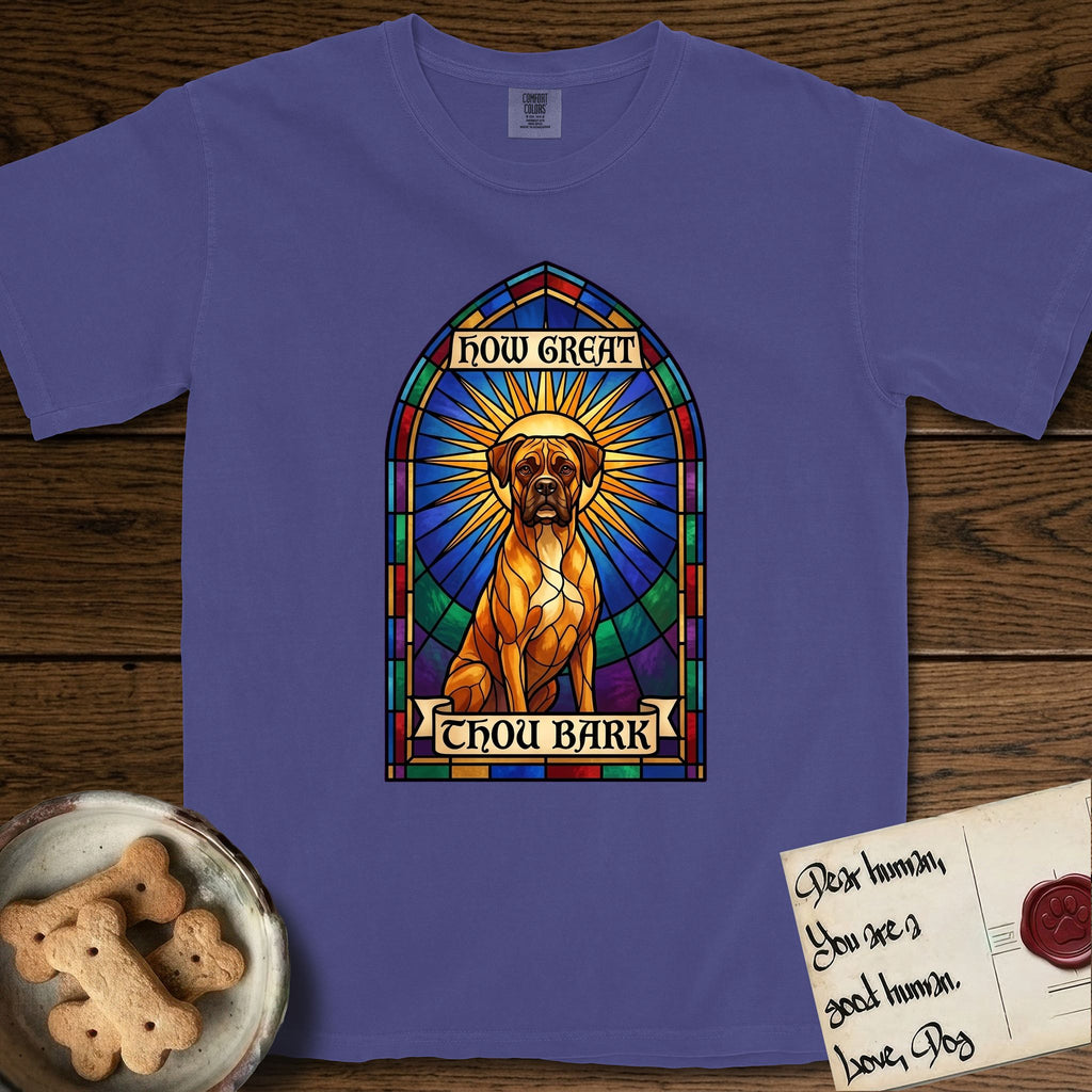 How Great Thou Bark Boxer T-Shirt flat lay in Grape, featuring a full-color stained-glass saint window of a Boxer seated in warm golden light with a halo.