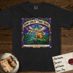How Great Thou Bark Golden Retriever T-Shirt flat lay in Black, featuring a full-color stained-glass saint window of a Golden Retriever standing on a mountain with light breaking through the clouds and a halo.