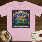How Great Thou Bark Golden Retriever T-Shirt flat lay in Blossom, featuring a full-color stained-glass saint window of a Golden Retriever standing on a mountain with light breaking through the clouds and a halo.