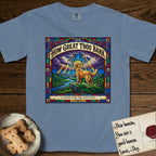 How Great Thou Bark Golden Retriever T-Shirt flat lay in Blue Jean, featuring a full-color stained-glass saint window of a Golden Retriever standing on a mountain with light breaking through the clouds and a halo.