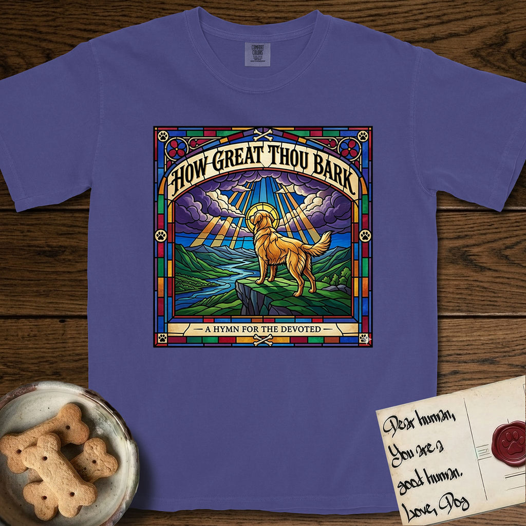 How Great Thou Bark Golden Retriever T-Shirt flat lay in Grape, featuring a full-color stained-glass saint window of a Golden Retriever standing on a mountain with light breaking through the clouds and a halo.