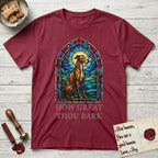 How Great Thou Bark Greyhound T-Shirt flat lay in Cardinal Red, featuring a full-color stained-glass saint window of a Greyhound sitting in stillness, with a halo.
