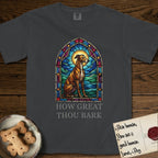 How Great Thou Bark Greyhound T-Shirt flat lay in Graphite, featuring a full-color stained-glass saint window of a Greyhound sitting in stillness, with a halo.