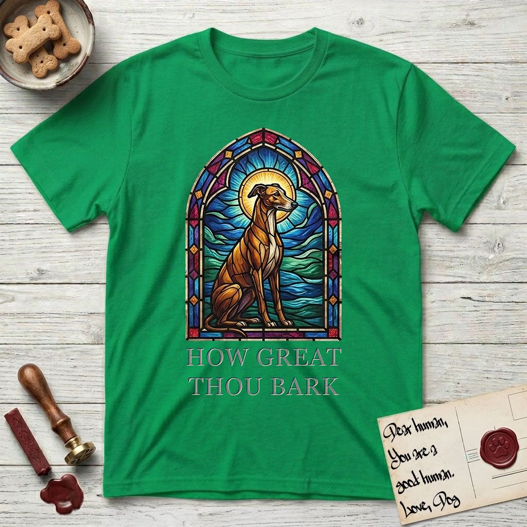 How Great Thou Bark Greyhound T-Shirt flat lay in Irish Green, featuring a full-color stained-glass saint window of a Greyhound sitting in stillness, with a halo.