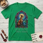 How Great Thou Bark Greyhound T-Shirt flat lay in Irish Green, featuring a full-color stained-glass saint window of a Greyhound sitting in stillness, with a halo.