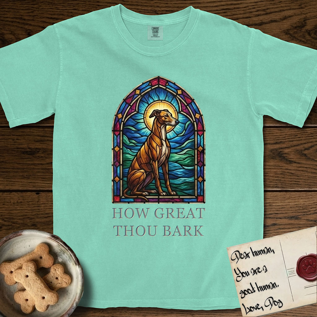 How Great Thou Bark Greyhound T-Shirt flat lay in Island Reef, featuring a full-color stained-glass saint window of a Greyhound sitting in stillness, with a halo.