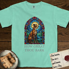 How Great Thou Bark Greyhound T-Shirt flat lay in Island Reef, featuring a full-color stained-glass saint window of a Greyhound sitting in stillness, with a halo.