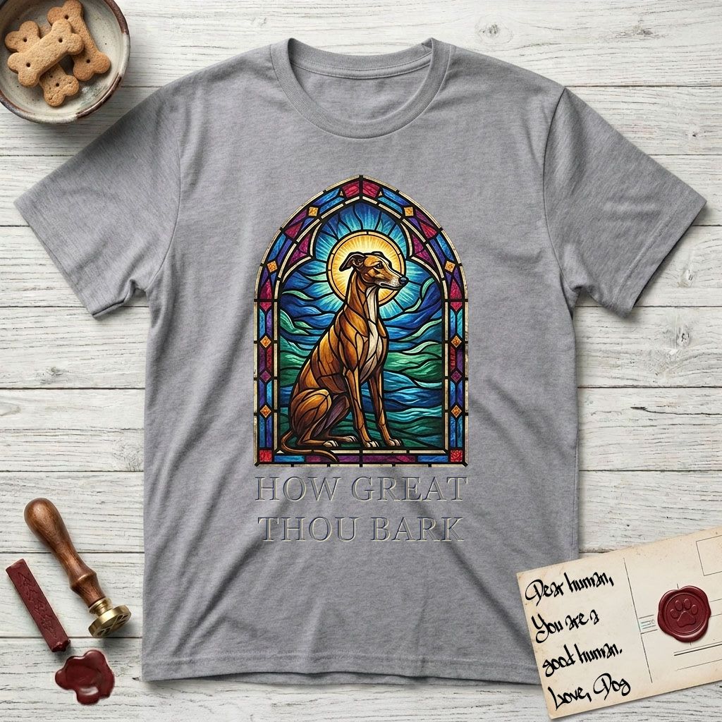 How Great Thou Bark Greyhound T-Shirt flat lay in Sport Grey, featuring a full-color stained-glass saint window of a Greyhound sitting in stillness, with a halo.