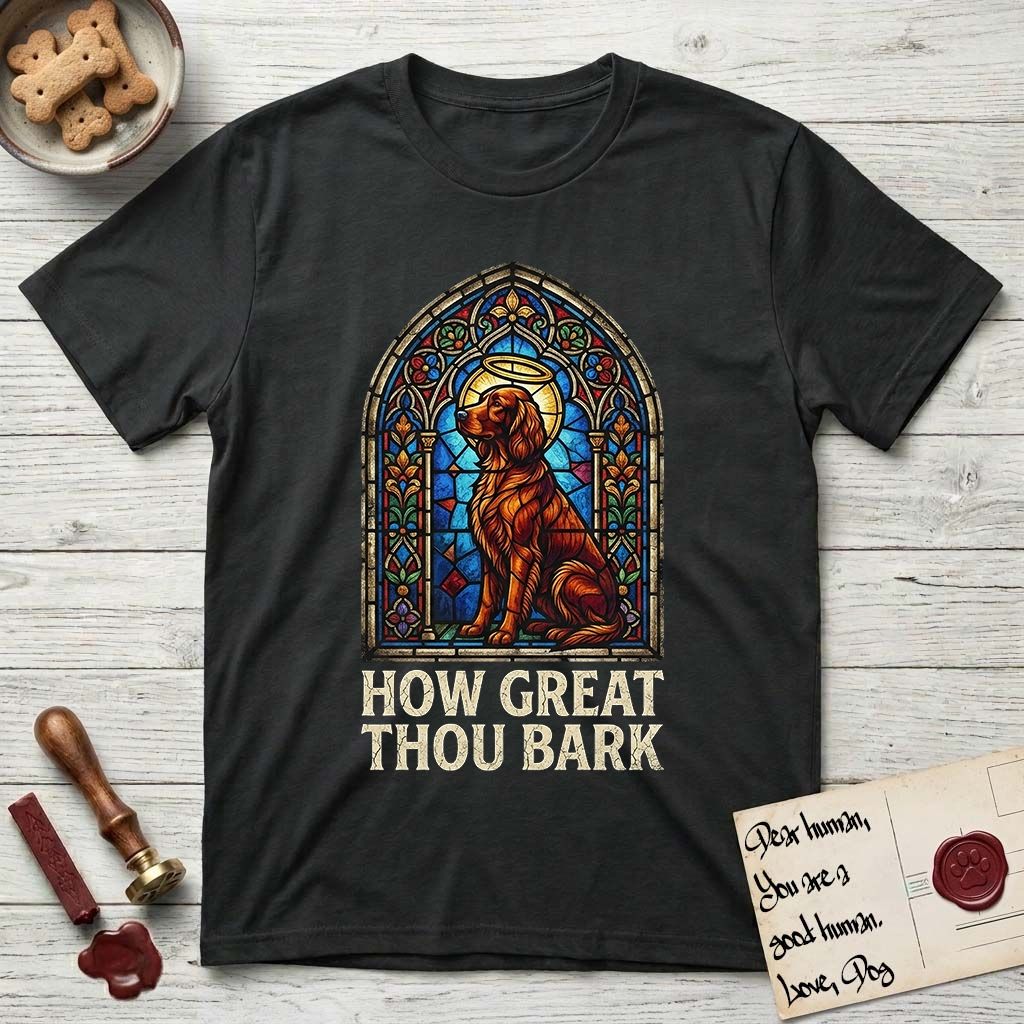 How Great Thou Bark Irish Setter T-Shirt flat lay in Black, featuring a full-color stained-glass saint window of an Irish Setter seated and gazing up into the light, with a halo.