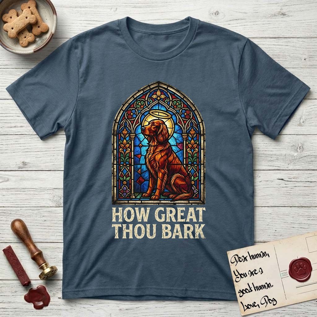 How Great Thou Bark Irish Setter T-Shirt flat lay in Indigo Blue, featuring a full-color stained-glass saint window of an Irish Setter seated and gazing up into the light, with a halo.