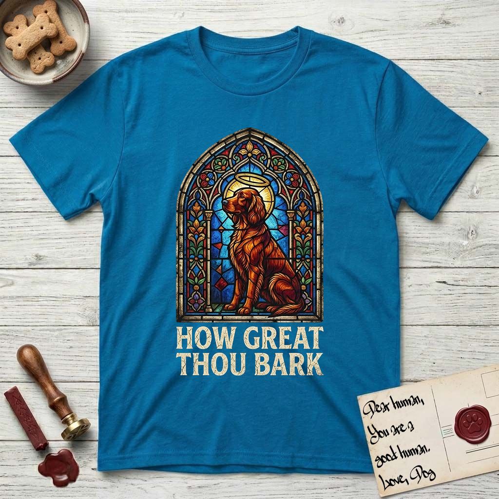 How Great Thou Bark Irish Setter T-Shirt flat lay in Sapphire, featuring a full-color stained-glass saint window of an Irish Setter seated and gazing up into the light, with a halo.