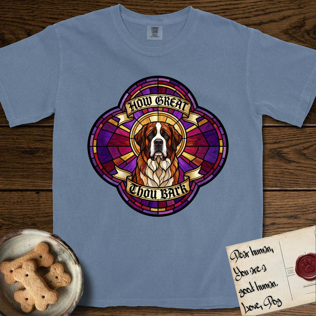 How Great Thou Bark Saint Bernard T-Shirt flat lay in Blue Jean, featuring a full-color stained-glass saint window of a red and white Saint Bernard facing forward, haloed in golden light.