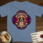 How Great Thou Bark Saint Bernard T-Shirt flat lay in Blue Jean, featuring a full-color stained-glass saint window of a red and white Saint Bernard facing forward, haloed in golden light.