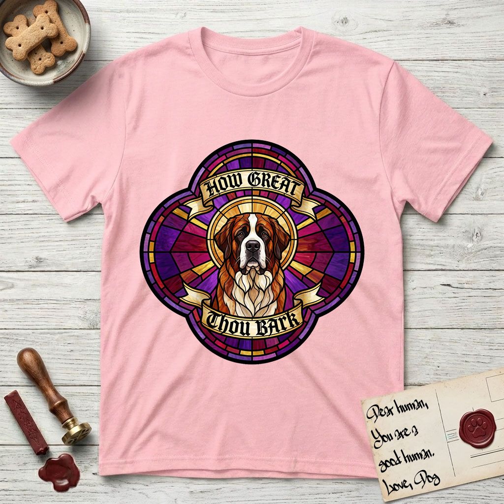 How Great Thou Bark Saint Bernard T-Shirt flat lay in Light Pink, featuring a full-color stained-glass saint window of a red and white Saint Bernard facing forward, haloed in golden light.