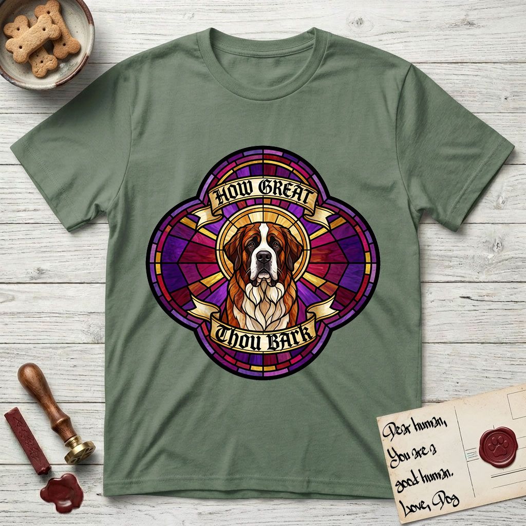 How Great Thou Bark Saint Bernard T-Shirt flat lay in Military Green, featuring a full-color stained-glass saint window of a red and white Saint Bernard facing forward, haloed in golden light.
