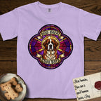 How Great Thou Bark Saint Bernard T-Shirt flat lay in Orchid, featuring a full-color stained-glass saint window of a red and white Saint Bernard facing forward, haloed in golden light.