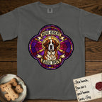 How Great Thou Bark Saint Bernard T-Shirt flat lay in Pepper, featuring a full-color stained-glass saint window of a red and white Saint Bernard facing forward, haloed in golden light.