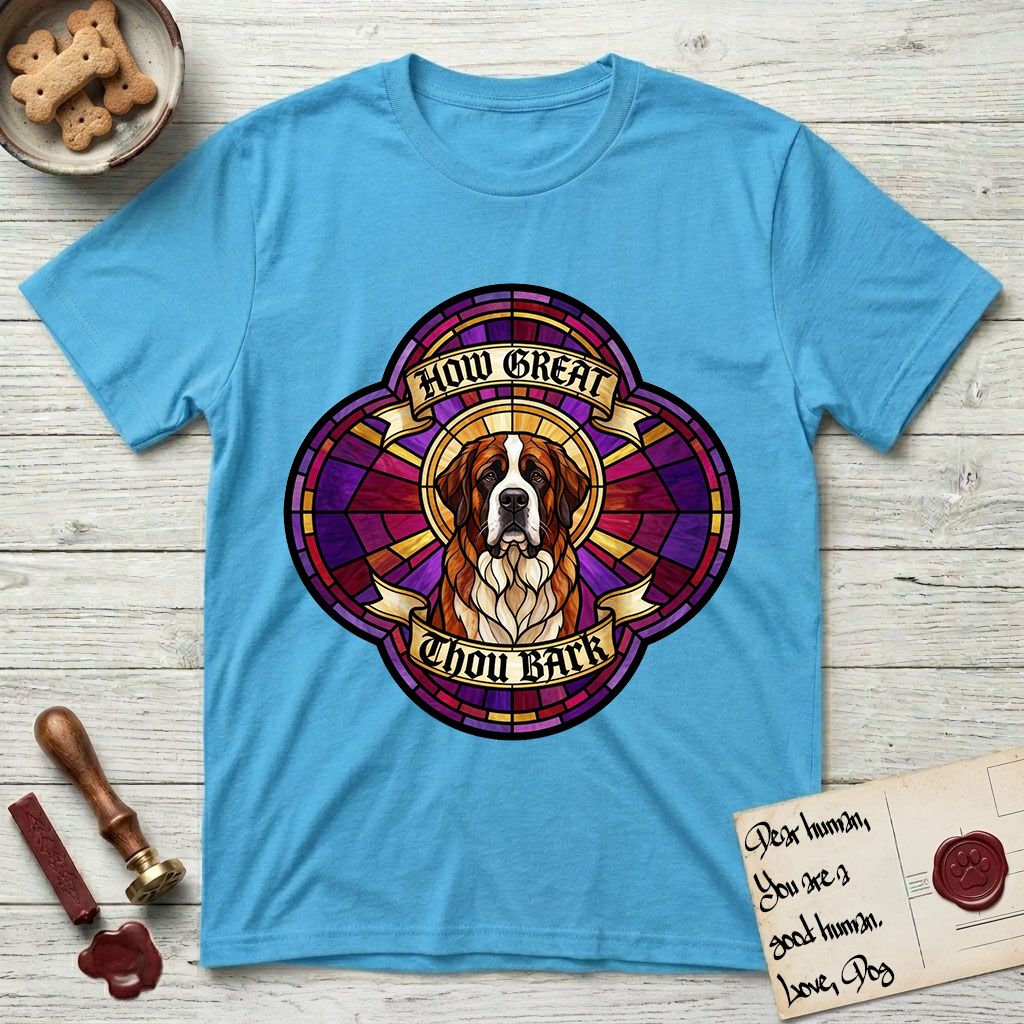 How Great Thou Bark Saint Bernard T-Shirt flat lay in Sky, featuring a full-color stained-glass saint window of a red and white Saint Bernard facing forward, haloed in golden light.