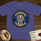How Great Thou Bark Schnauzer T-Shirt flat lay in Grape, featuring a full-color stained-glass saint window of a salt-and-pepper Schnauzer with bushy eyebrows and beard, haloed in golden light.