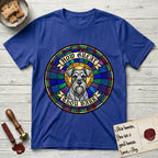 How Great Thou Bark Schnauzer T-Shirt flat lay in Heather Royal, featuring a full-color stained-glass saint window of a salt-and-pepper Schnauzer with bushy eyebrows and beard, haloed in golden light.