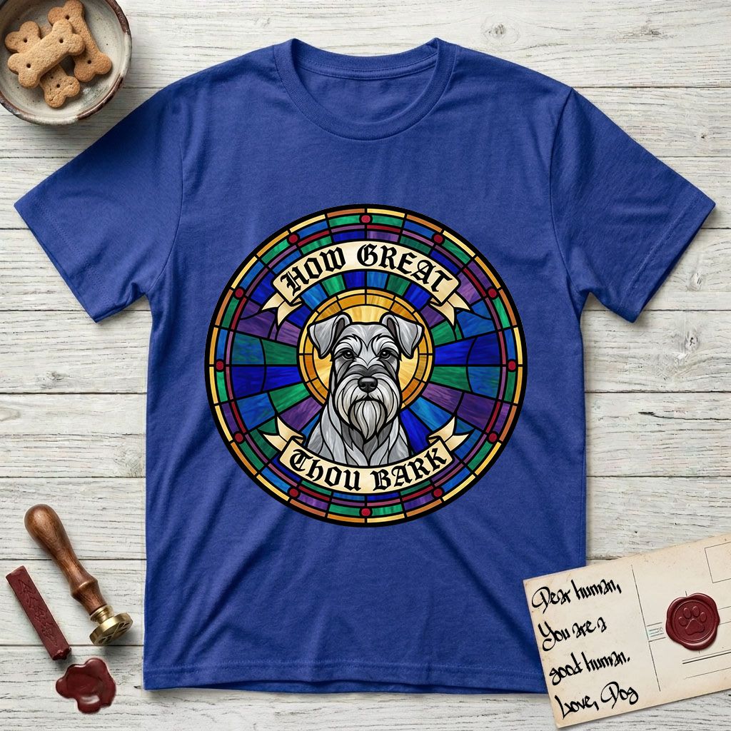 How Great Thou Bark Schnauzer T-Shirt flat lay in Heather Royal, featuring a full-color stained-glass saint window of a salt-and-pepper Schnauzer with bushy eyebrows and beard, haloed in golden light.