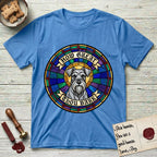 How Great Thou Bark Schnauzer T-Shirt flat lay in Heather Sapphire, featuring a full-color stained-glass saint window of a salt-and-pepper Schnauzer with bushy eyebrows and beard, haloed in golden light.
