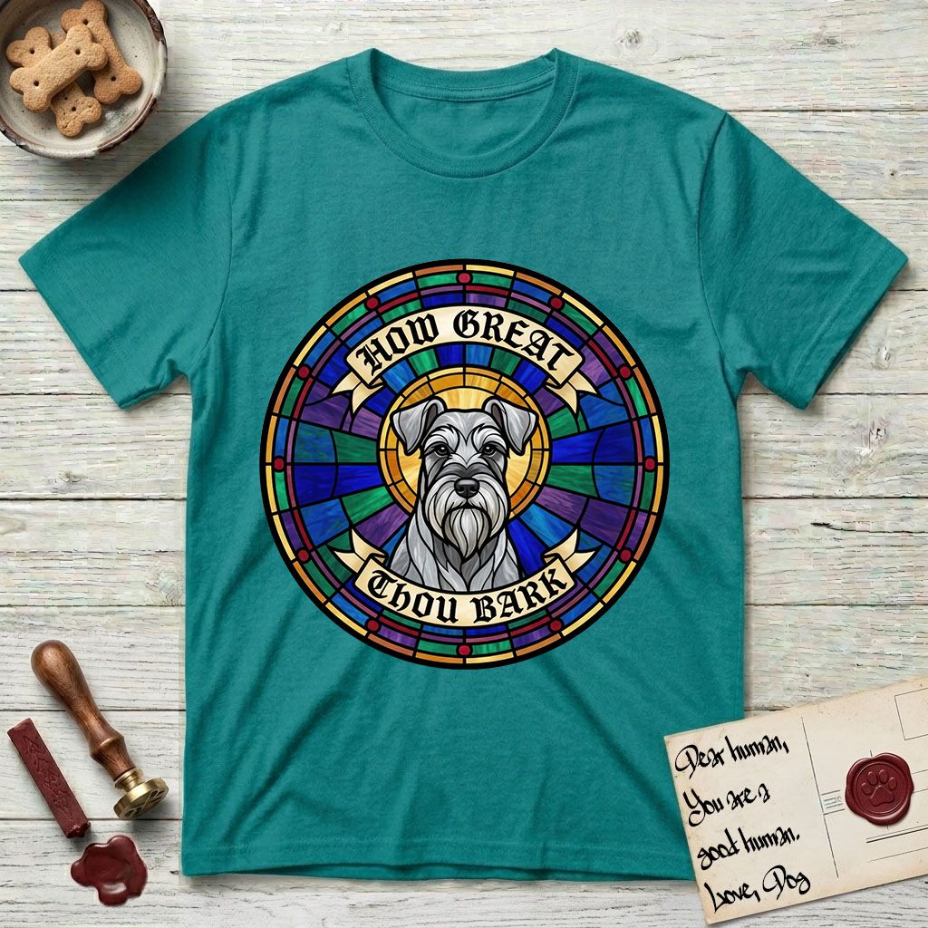 How Great Thou Bark Schnauzer T-Shirt flat lay in Jade Dome, featuring a full-color stained-glass saint window of a salt-and-pepper Schnauzer with bushy eyebrows and beard, haloed in golden light.