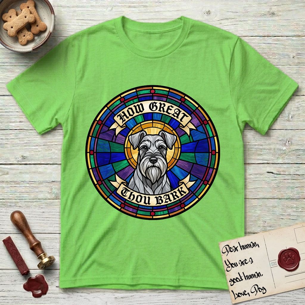 How Great Thou Bark Schnauzer T-Shirt flat lay in Lime, featuring a full-color stained-glass saint window of a salt-and-pepper Schnauzer with bushy eyebrows and beard, haloed in golden light.