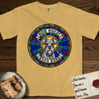 How Great Thou Bark Schnauzer T-Shirt flat lay in Mustard, featuring a full-color stained-glass saint window of a salt-and-pepper Schnauzer with bushy eyebrows and beard, haloed in golden light.