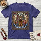 Holy Holy Holy Newfoundland T-Shirt flat lay in Metro Blue, featuring a gothic stained-glass window in jewel tones with a Newfoundland at center, Celtic knotwork border, corner paw prints, and the words Holy Holy Holy and Dog Almighty.
