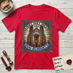 Holy Holy Holy Newfoundland T-Shirt flat lay in Red, featuring a gothic stained-glass window in jewel tones with a Newfoundland at center, Celtic knotwork border, corner paw prints, and the words Holy Holy Holy and Dog Almighty.