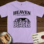Heaven Isn't a Place Beagle T-Shirt flat lay in Orchid, featuring Black ink engraving illustration of a tricolor Beagle asleep on top of the giant carved block letters BEAGLE, under the lettering HEAVEN isn't a place..