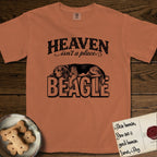Heaven Isn't a Place Beagle T-Shirt flat lay in Yam, featuring Black ink engraving illustration of a tricolor Beagle asleep on top of the giant carved block letters BEAGLE, under the lettering HEAVEN isn't a place..