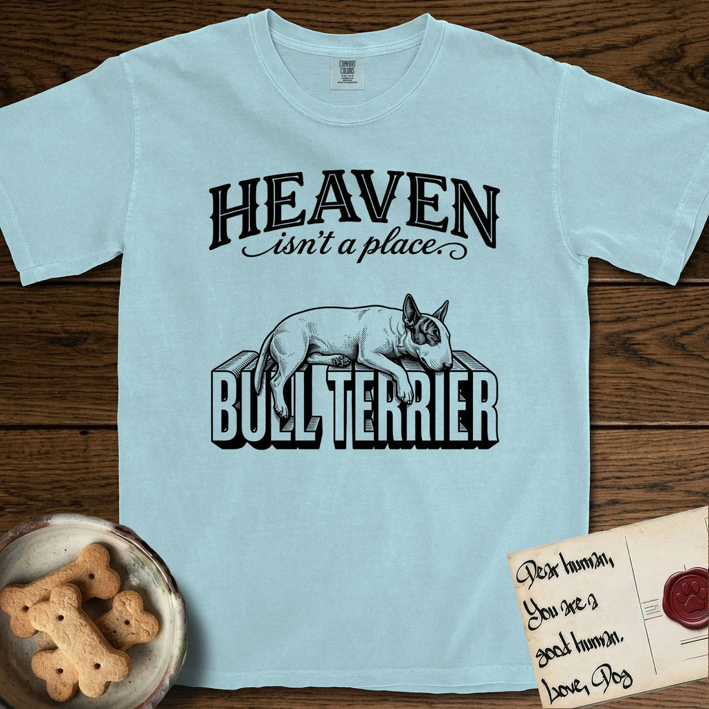 Heaven Isn't a Place Bull Terrier T-Shirt flat lay in Chambray, featuring Black ink engraving illustration of a Bull Terrier with a dark patch over one eye asleep on top of the giant carved block letters BULL TERRIER, under the lettering HEAVEN isn't a place..