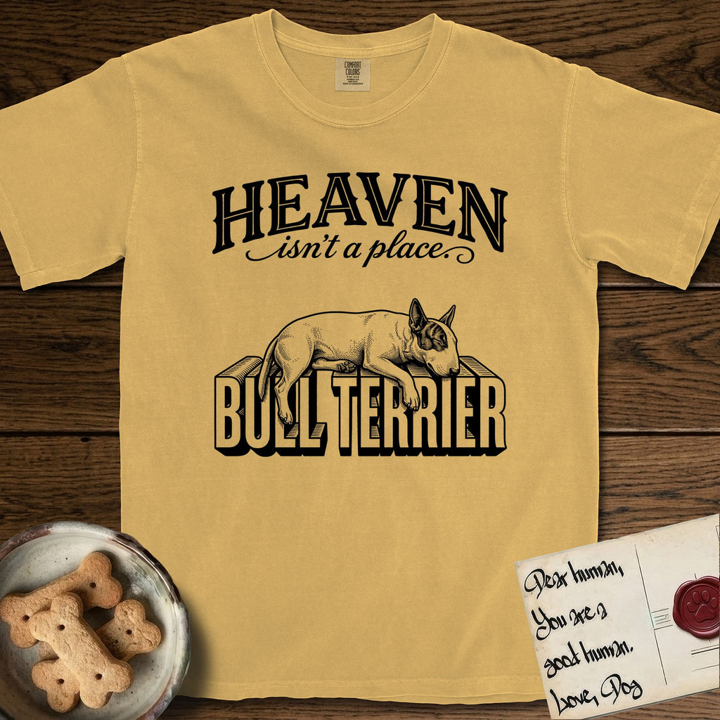 Heaven Isn't a Place Bull Terrier T-Shirt flat lay in Mustard, featuring Black ink engraving illustration of a Bull Terrier with a dark patch over one eye asleep on top of the giant carved block letters BULL TERRIER, under the lettering HEAVEN isn't a place..