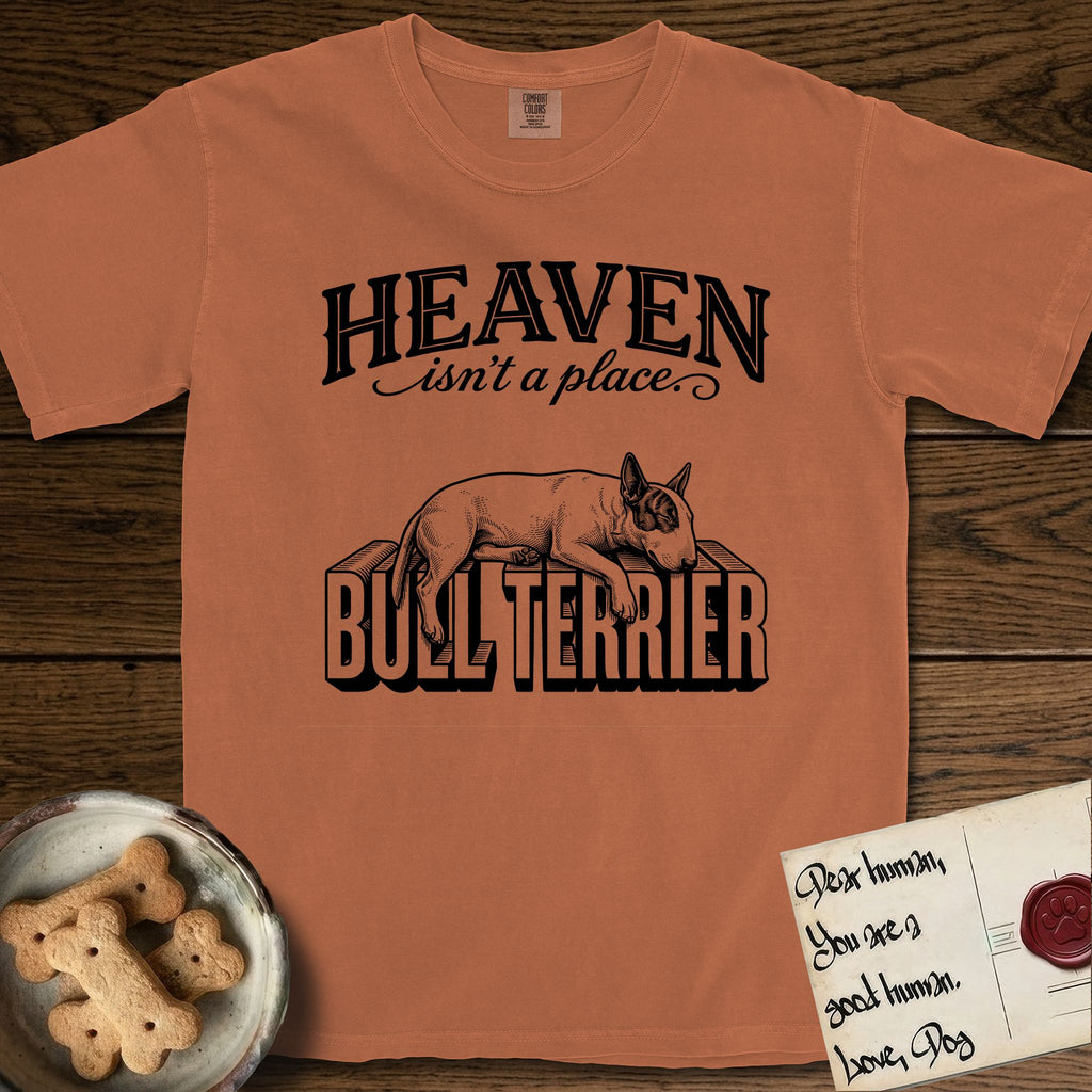 Heaven Isn't a Place Bull Terrier T-Shirt flat lay in Yam, featuring Black ink engraving illustration of a Bull Terrier with a dark patch over one eye asleep on top of the giant carved block letters BULL TERRIER, under the lettering HEAVEN isn't a place..