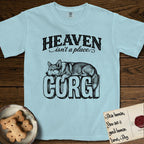 Heaven Isn't a Place Corgi T-Shirt flat lay in Chambray, featuring Black ink engraving illustration of a Corgi with a long fluffy tail asleep on top of the giant carved block letters CORGI, under the lettering HEAVEN isn't a place..