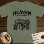 Heaven Isn't a Place French Bulldog T-Shirt flat lay in Sage, featuring Black ink engraving illustration of a brindle French Bulldog asleep on top of the giant carved block letters FRENCHIE, under the lettering HEAVEN isn't a place..