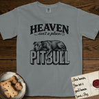 Heaven Isn't a Place Pitbull T-Shirt flat lay in Granite, featuring Black ink engraving illustration of a Pitbull asleep on top of the giant carved block letters PITBULL, under the lettering HEAVEN isn't a place..