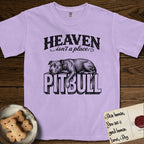 Heaven Isn't a Place Pitbull T-Shirt flat lay in Orchid, featuring Black ink engraving illustration of a Pitbull asleep on top of the giant carved block letters PITBULL, under the lettering HEAVEN isn't a place..