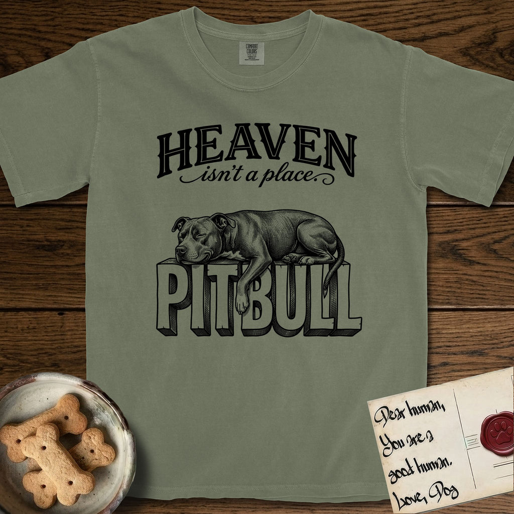 Heaven Isn't a Place Pitbull T-Shirt flat lay in Sage, featuring Black ink engraving illustration of a Pitbull asleep on top of the giant carved block letters PITBULL, under the lettering HEAVEN isn't a place..