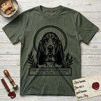 Holy Orders Basset Hound T-Shirt flat lay in Heather Military Green, featuring a bold black-and-white linocut saint-medallion portrait of a Basset Hound.