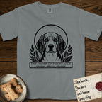 Holy Orders Beagle T-Shirt flat lay in Granite, featuring a bold black-and-white linocut saint-medallion portrait of a Beagle.