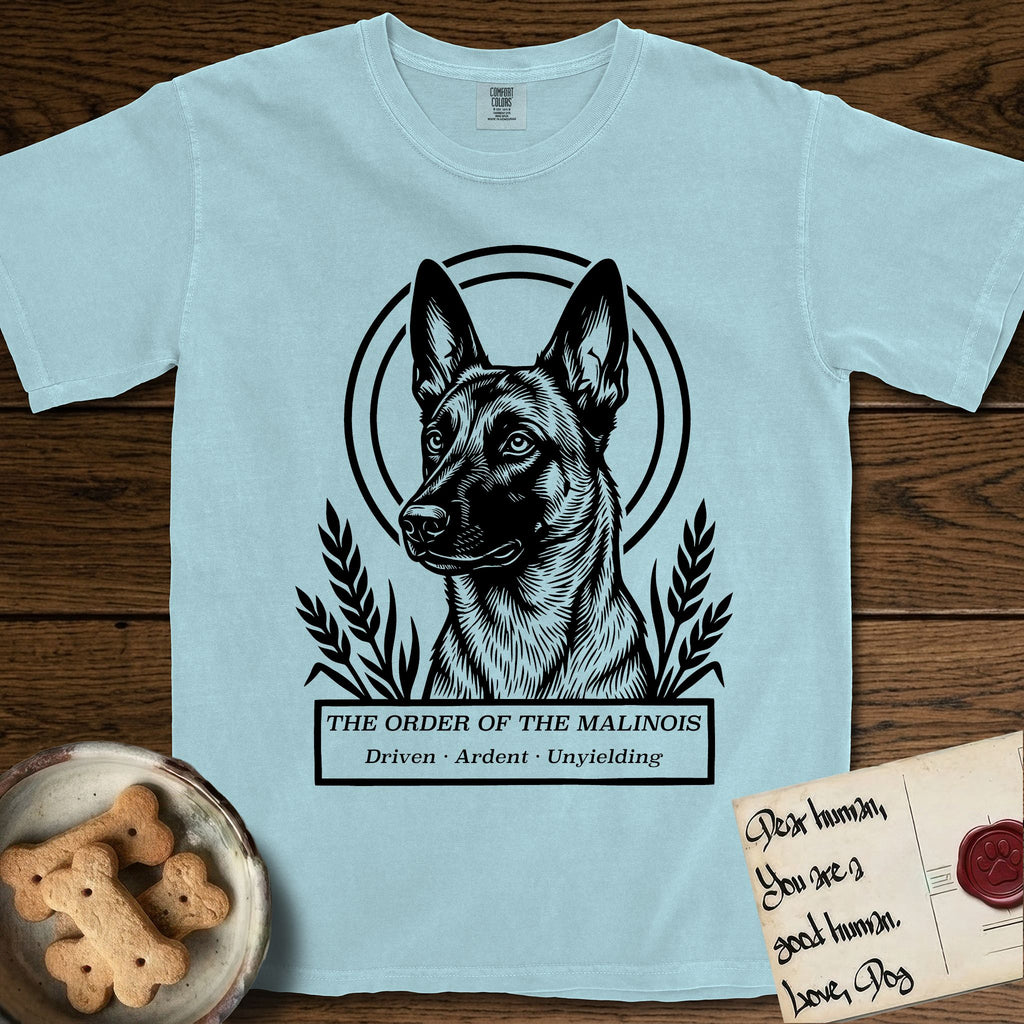 Holy Orders Belgian Malinois T-Shirt flat lay in Chambray, featuring a bold black-and-white linocut saint-medallion portrait of a Belgian Malinois.