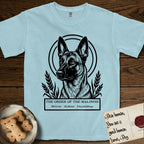 Holy Orders Belgian Malinois T-Shirt flat lay in Chambray, featuring a bold black-and-white linocut saint-medallion portrait of a Belgian Malinois.