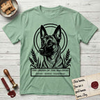 Holy Orders Belgian Malinois T-Shirt flat lay in Mint Green, featuring a bold black-and-white linocut saint-medallion portrait of a Belgian Malinois.