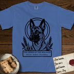Holy Orders Belgian Malinois T-Shirt flat lay in Mystic Blue, featuring a bold black-and-white linocut saint-medallion portrait of a Belgian Malinois.