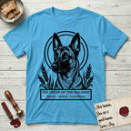 Holy Orders Belgian Malinois T-Shirt flat lay in Sky, featuring a bold black-and-white linocut saint-medallion portrait of a Belgian Malinois.