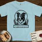 Holy Orders Border Collie T-Shirt flat lay in Chambray, featuring a bold black-and-white linocut saint-medallion portrait of a Border Collie.