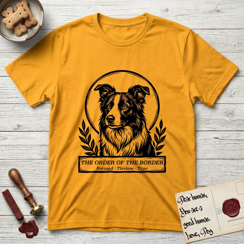 Holy Orders Border Collie T-Shirt flat lay in Gold, featuring a bold black-and-white linocut saint-medallion portrait of a Border Collie.